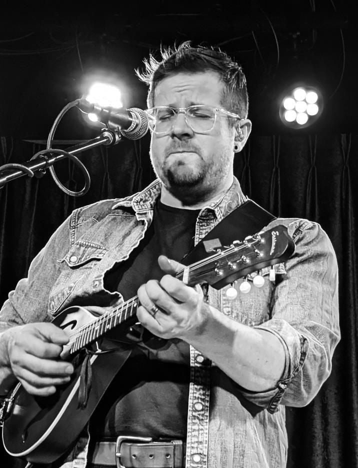 Zachari Smith playing mandolin live