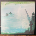 Album cover with a ship illustration and text on a textured surface